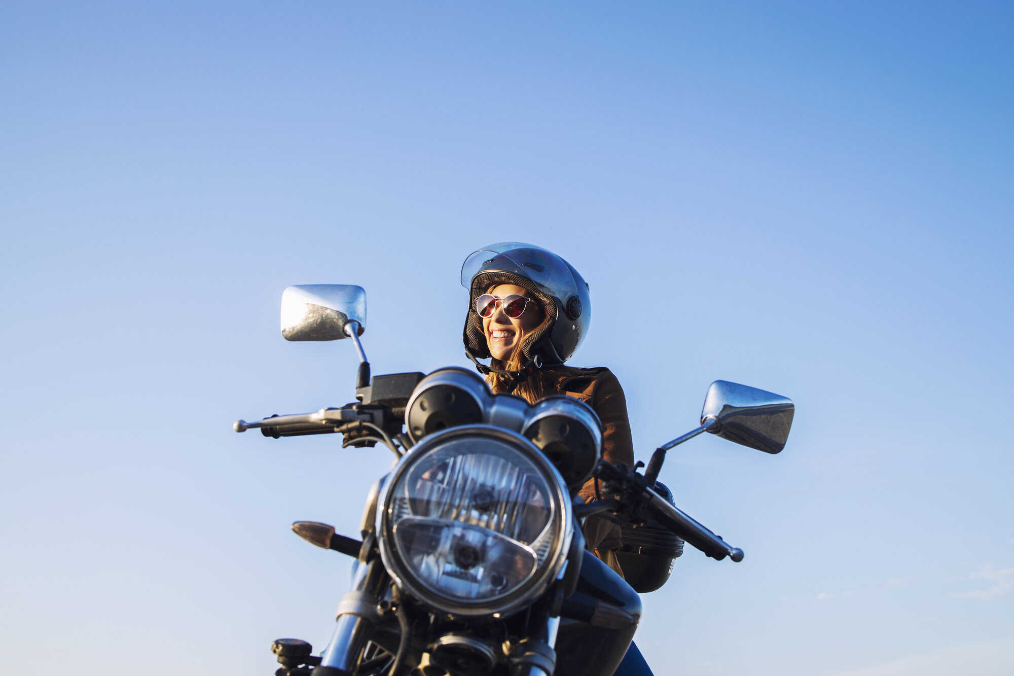 female-motorbike-rider-wearing-helmet-riding-retro-style-motorcycle female-motorbike-rider-wearing-helmet-riding-retro-style-motorcycle